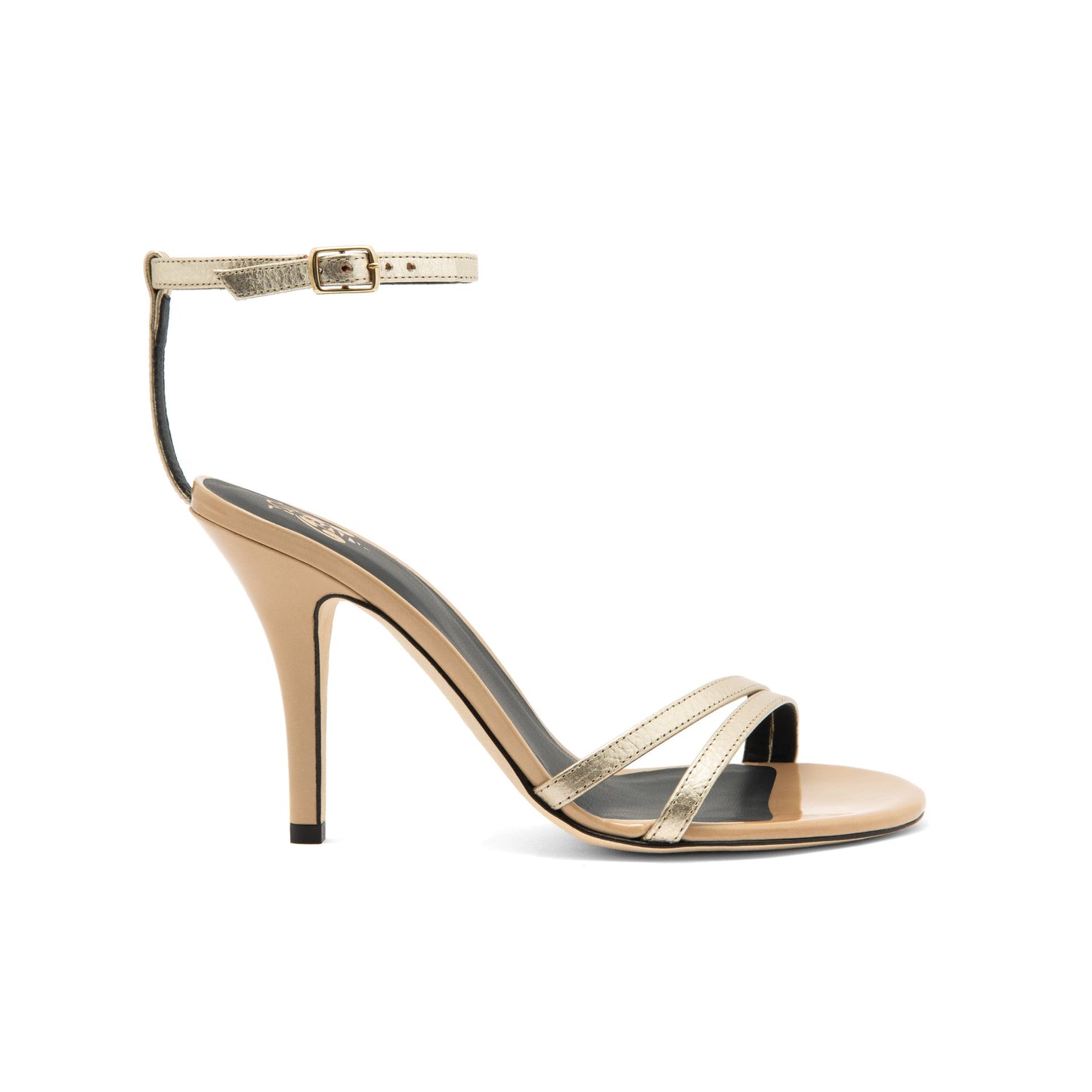 Two-tone sandal made of sand patent leather, with a front band created by two fine strips in gold laminate, ankle strap closed with side buckle. 3.9 inches heel