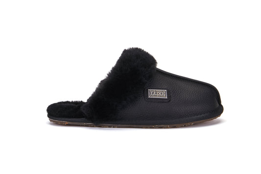 Black slipper with fur lining on a white background