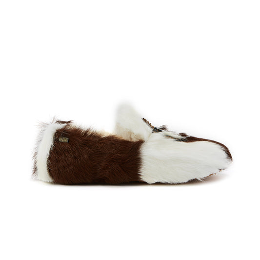 Brown and white fur slippers on a white background