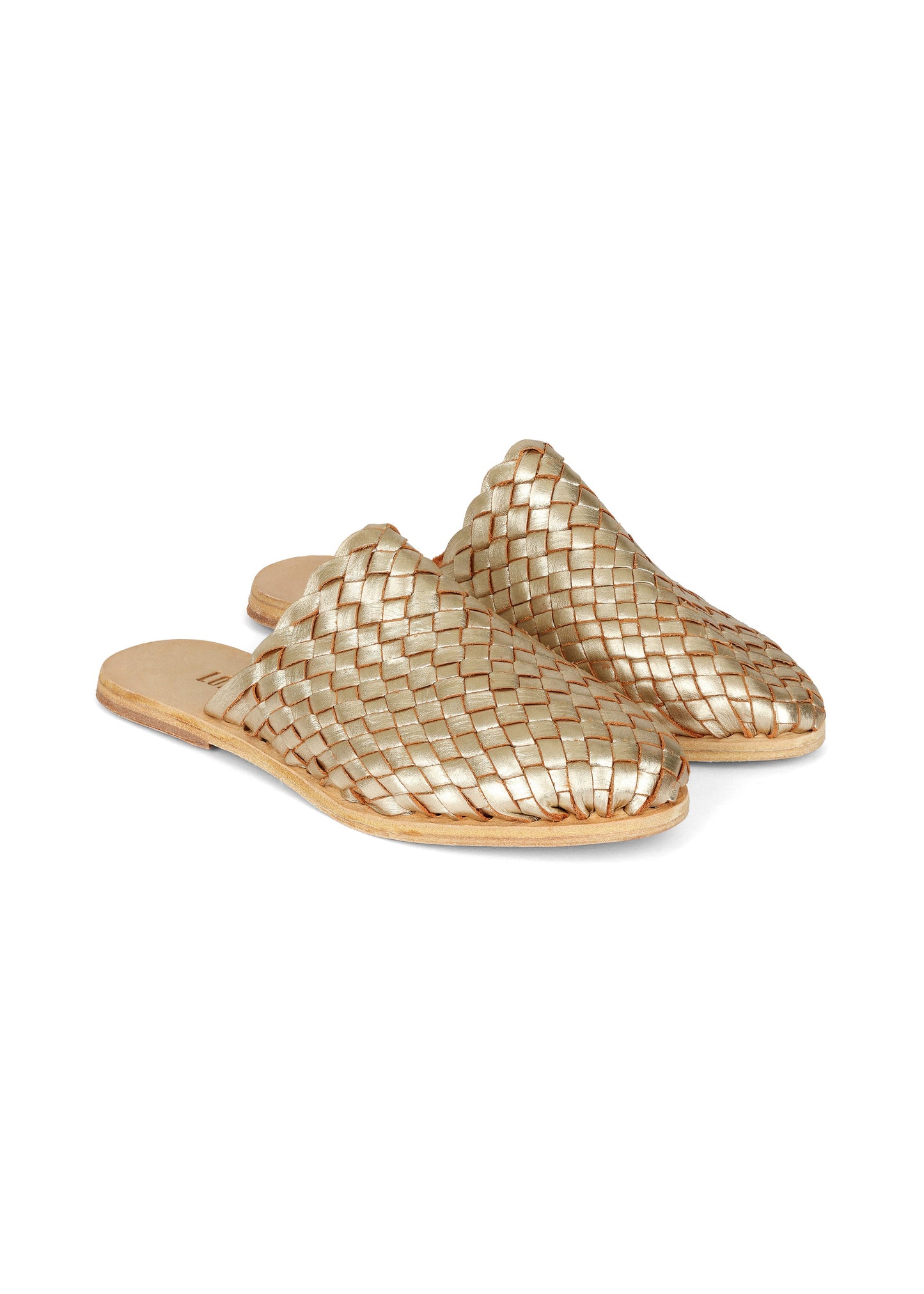 Pair of gold woven sandals on a white background